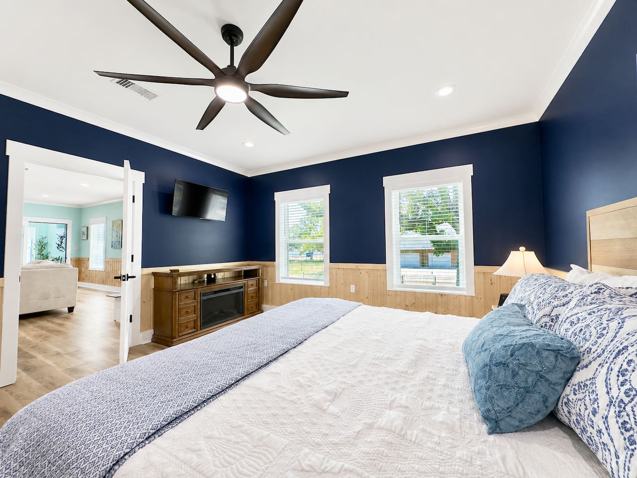 Rest easy in this bright space with cozy textures and charm.