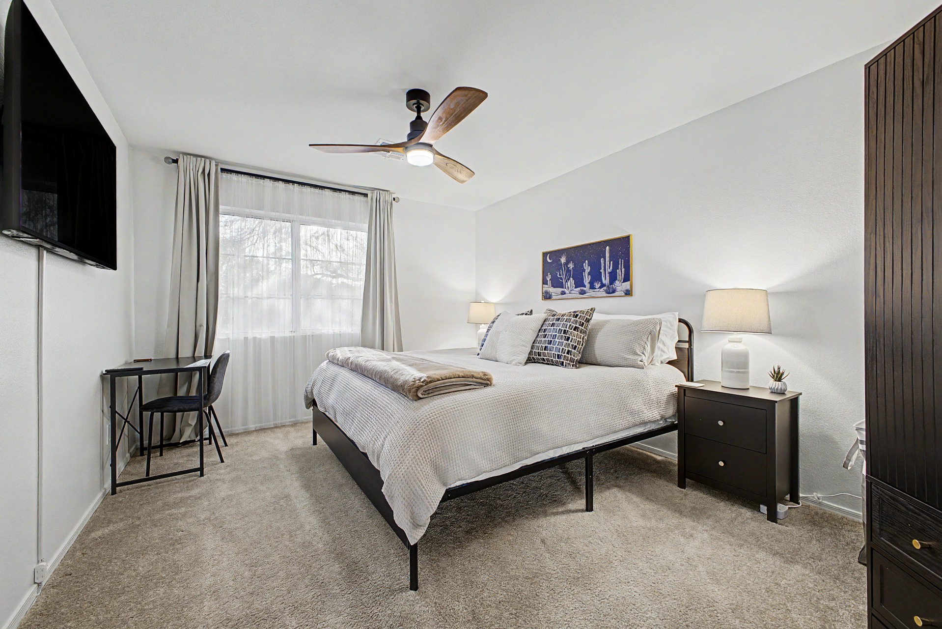 King bedroom 4 upstairs with 55" Smart TV, blackout curtains, ceiling fan, desk and chair