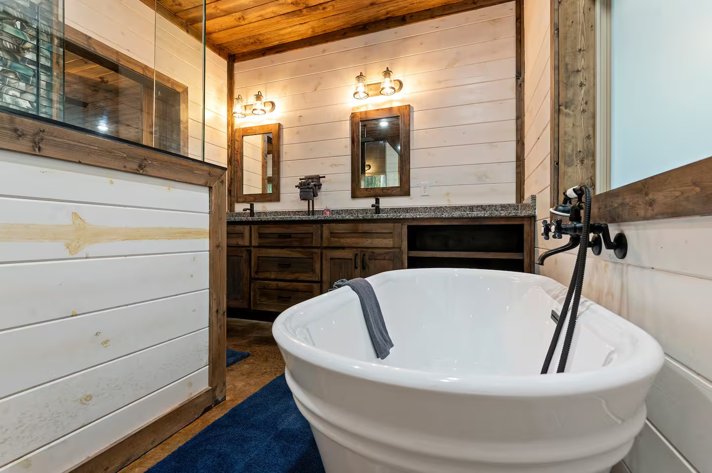 The primary ensuite offers a deep soaking tub that feels like your own spa sanctuary — perfect after a day on the lake or hiking the trails.