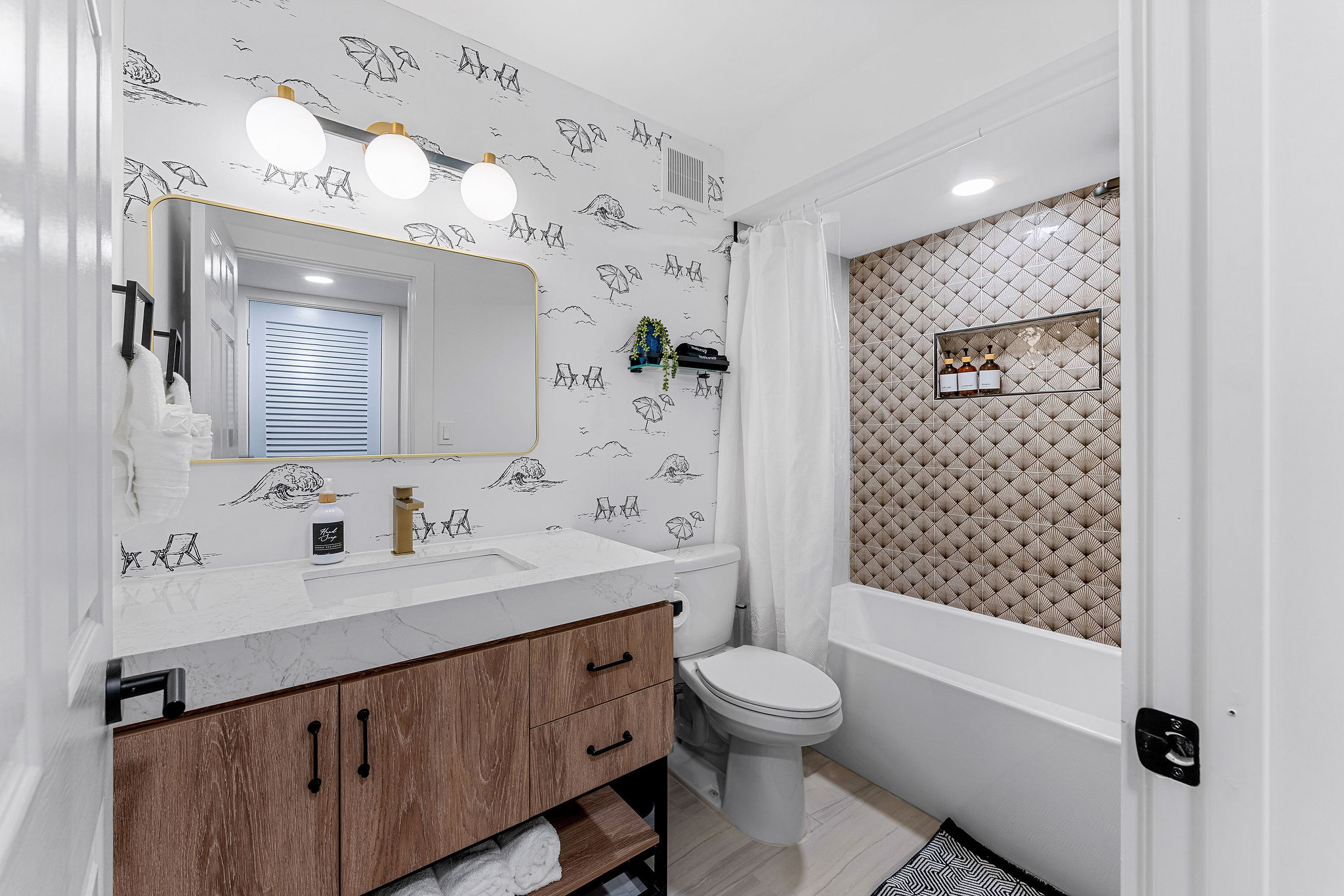 Guest bathroom with brand new bathroom renovation that is ready for you to enjoy! Towels, makeup towels, shampoo, conditioner, body wash and a blow dryer are provided for your ease.