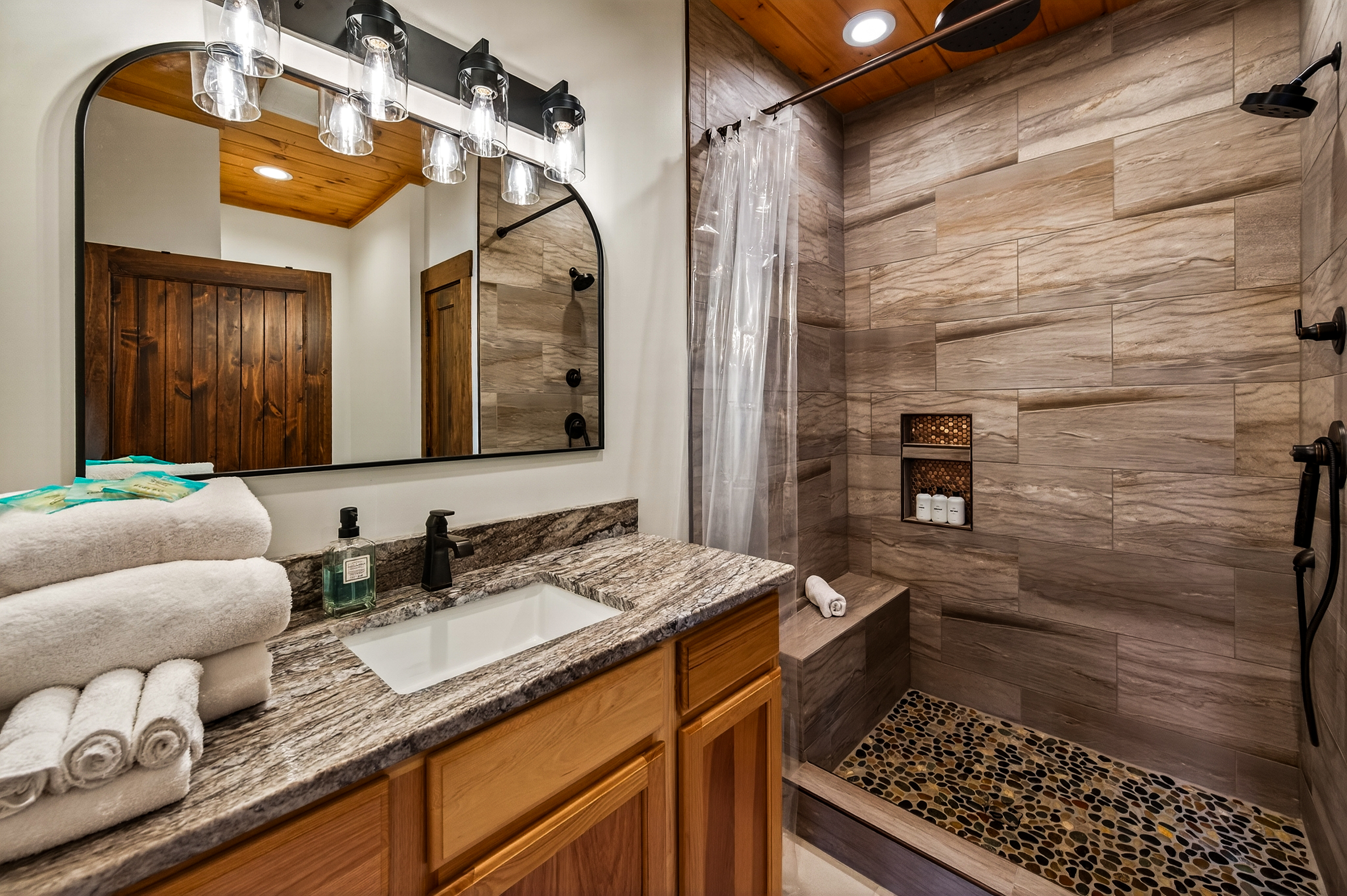 1st Floor Master King Suite –Enjoy the luxurious spa-style shower with a rain, hand & full shower head for the perfect start or end to your day. Plush towels & premium shampoo, conditioner & body wash are provided for a relaxing, hotel-style experience