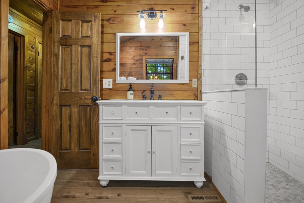 Master bath w/ vanity and tiled shower- main level