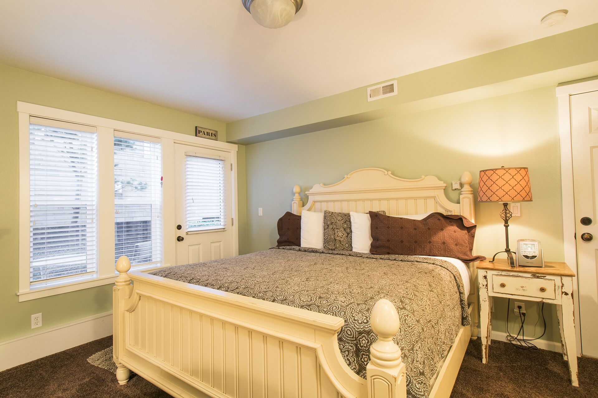 Paris Suite ~ The second master in the home, featuring its own private entrance, cozy fireplace, kitchenette, and Smart TV.