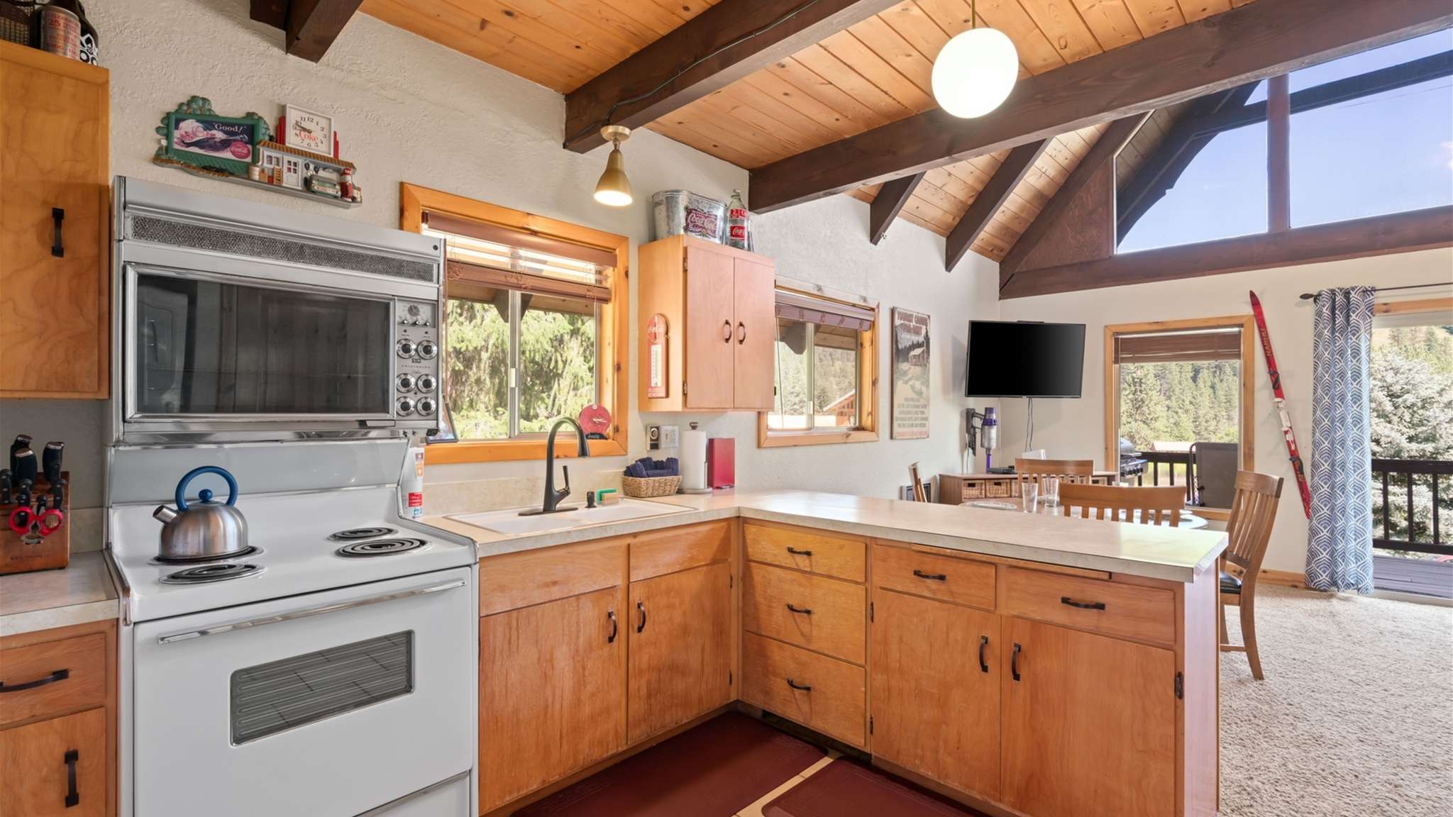 Functional kitchen layout with plenty of counter space and rustic design.
