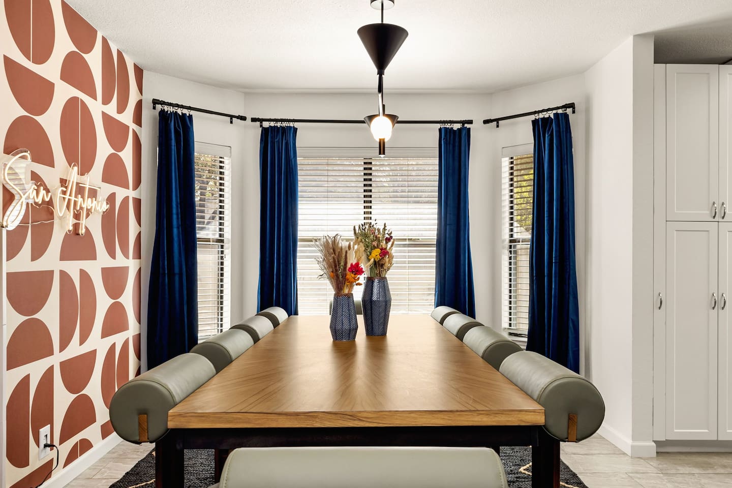  Bright and inviting dining space with natural light and seating for 10—perfect for sharing meals, stories, and celebrations with your group. A stylish spot to gather before a game, meeting, or night on the town.