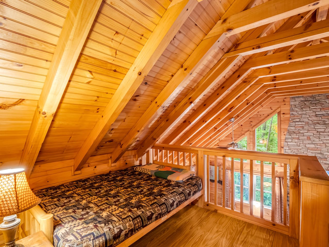 Charming loft sleeping nook, contains a twin bed, and overlooks the great room and dining area 