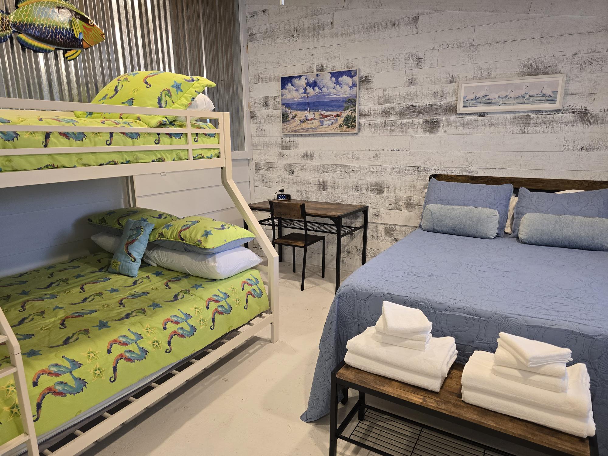 Bedroom 3 - 1 full sized bed and 1 bunk bed with a full and twin. Also includes desk and chair and TV