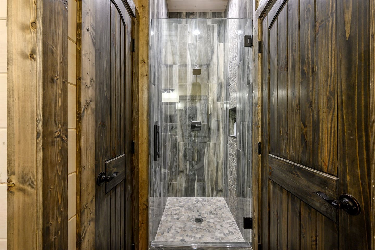 Shower in the Game/Bunk Room. Luxury Shower Retreat: Immerse yourself in this stunning stone-tiled shower oasis!