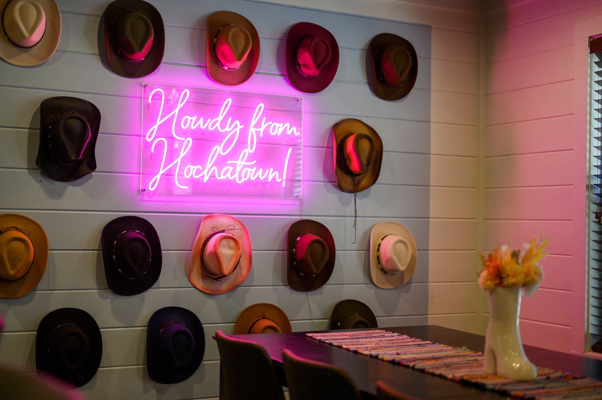 The hat wall up close – a playful, stylish feature that brings the cowboy spirit to your stay with every glance!