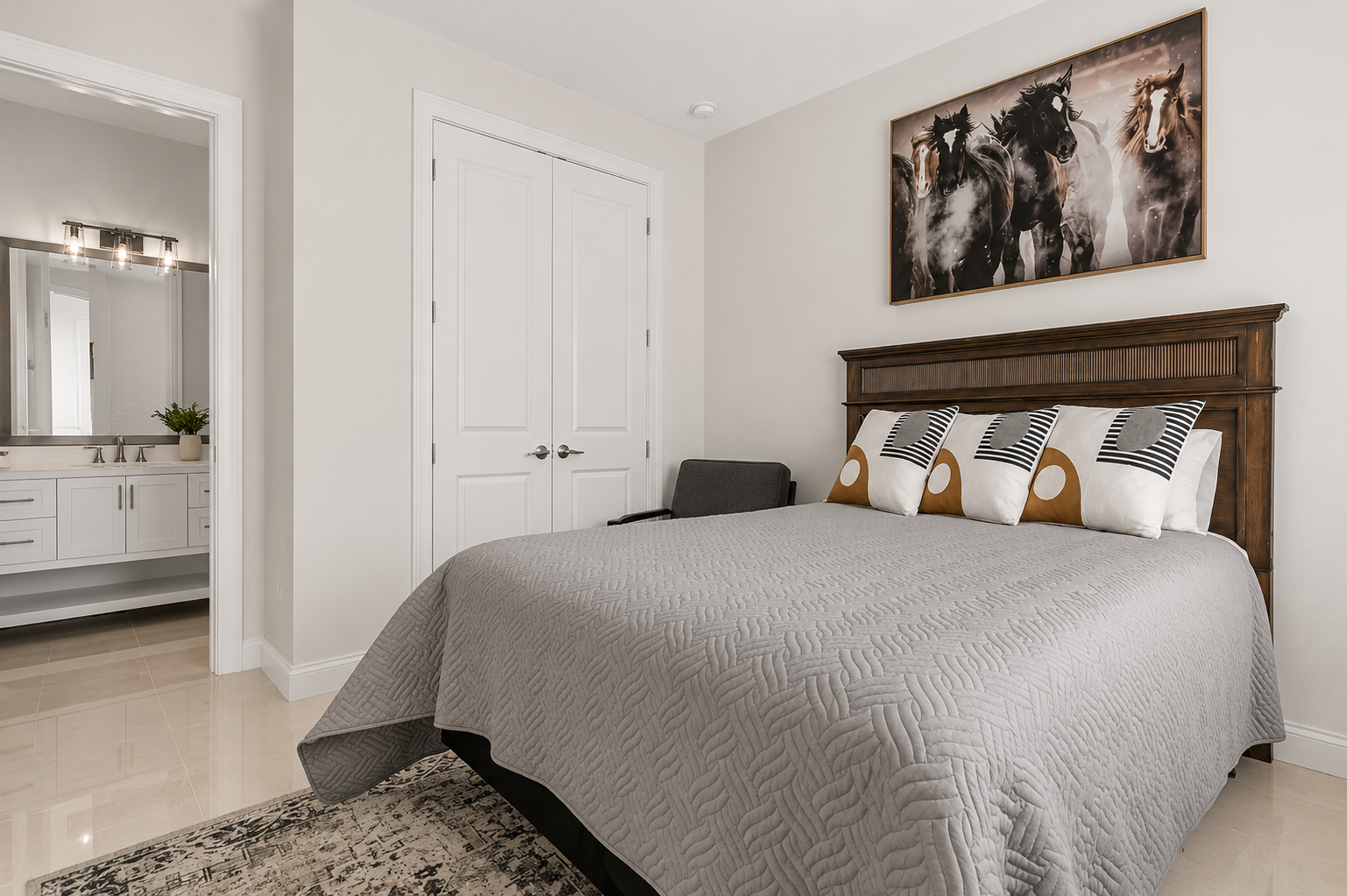 Every guest becomes family in this handsome en-suite bedroom, where bold art and warm wood tones invite deep, easy sleep. Close the door on a full day of sun, sink into crisp cool linens, and drift off dreaming of tomorrow's beachfront adventures.