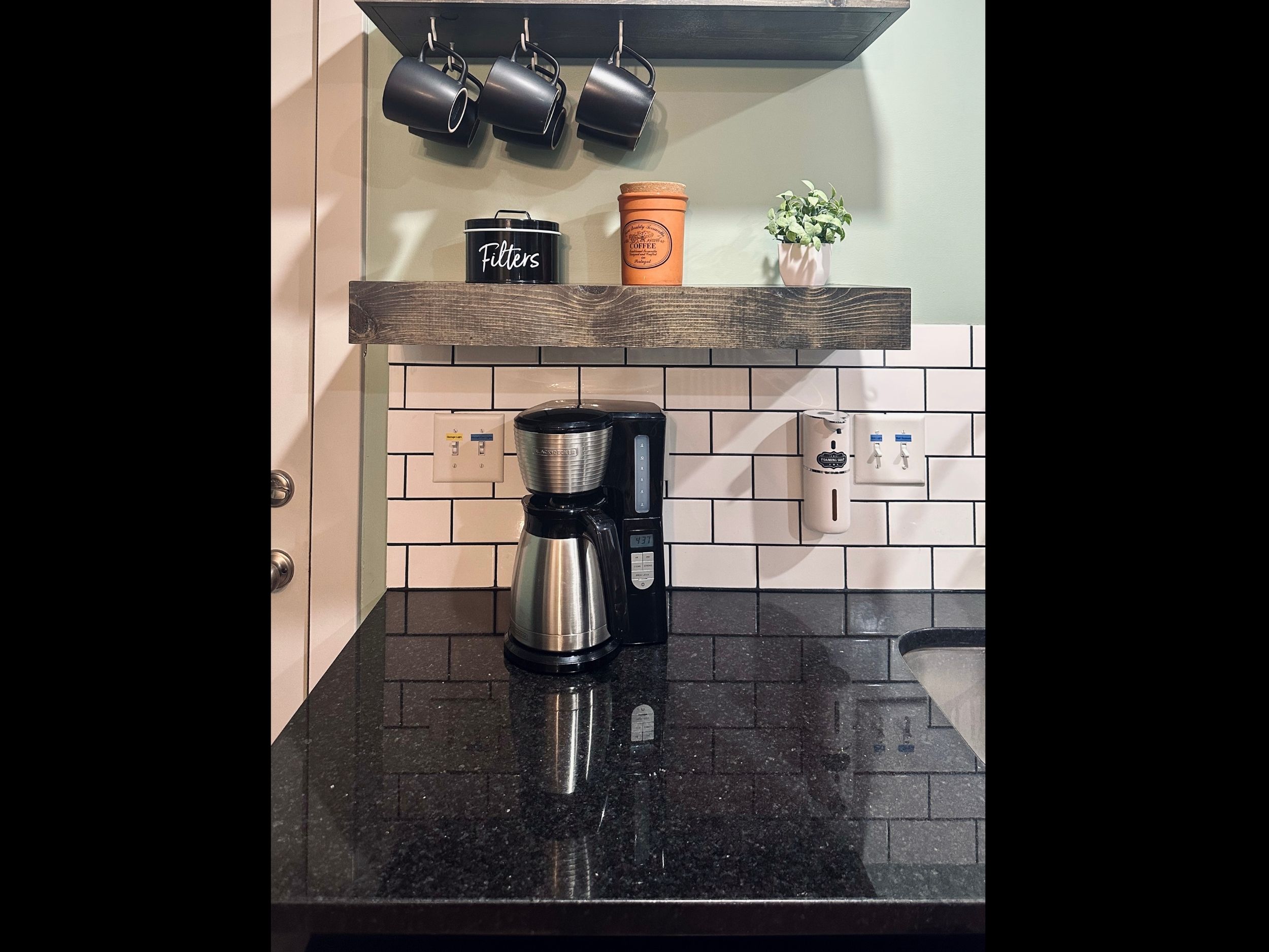 Dedicated coffee station complete with mugs, coffee maker, filters, and coffee to make mornings easy and inviting.