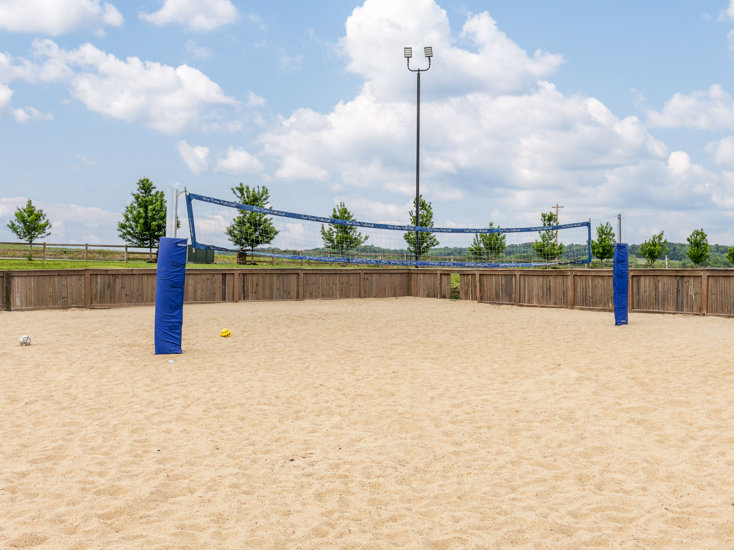 Challenge your group to a friendly match on the neighborhood sand volleyball court, one of many outdoor amenities available throughout the community.