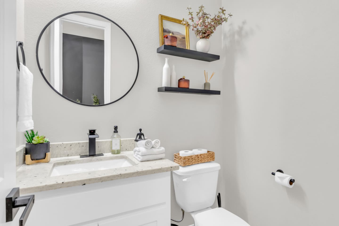 Second full bathroom with chic tile and modern fixtures.
