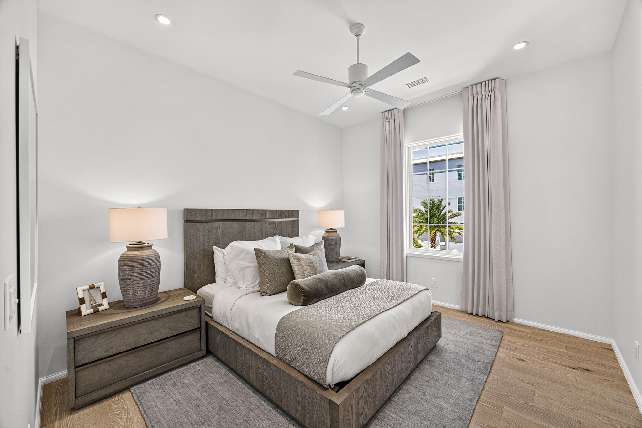 Guest Suite #1 is beautifully appointed with a queen size bed, oversized night stands, an ensuite bath, large closet, and built in desk area.