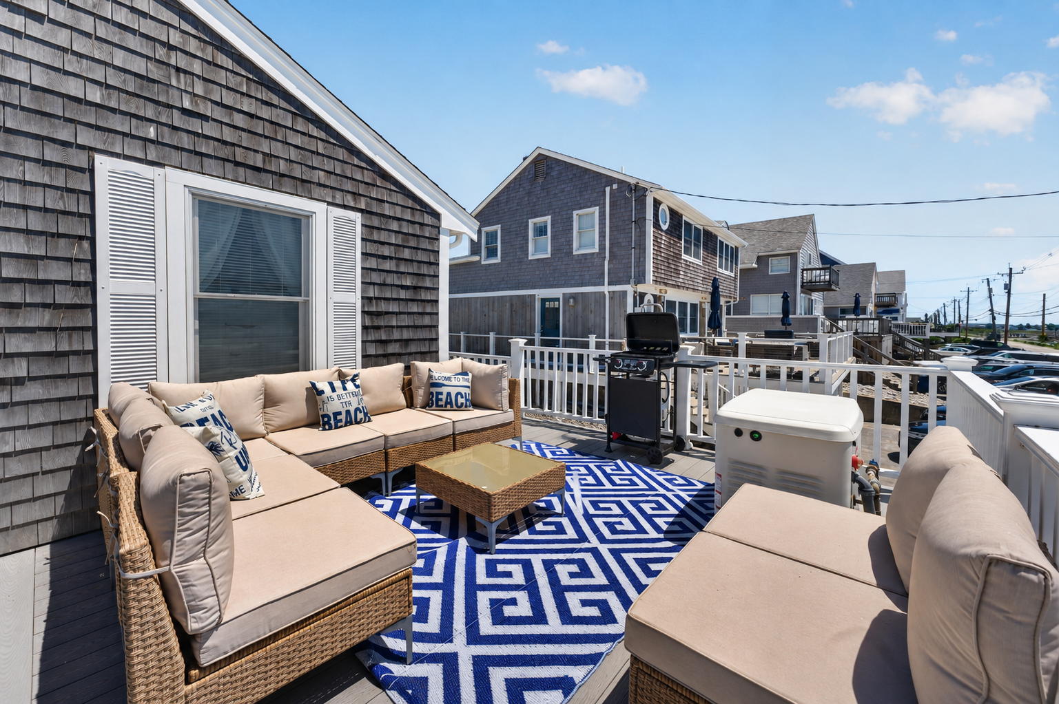 Gather outdoors on the comfortable deck seating for conversation, drinks, and fresh coastal air.
