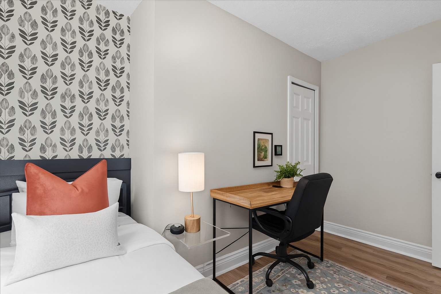 Chic bedroom with stylish accent wall and dedicated workspace
