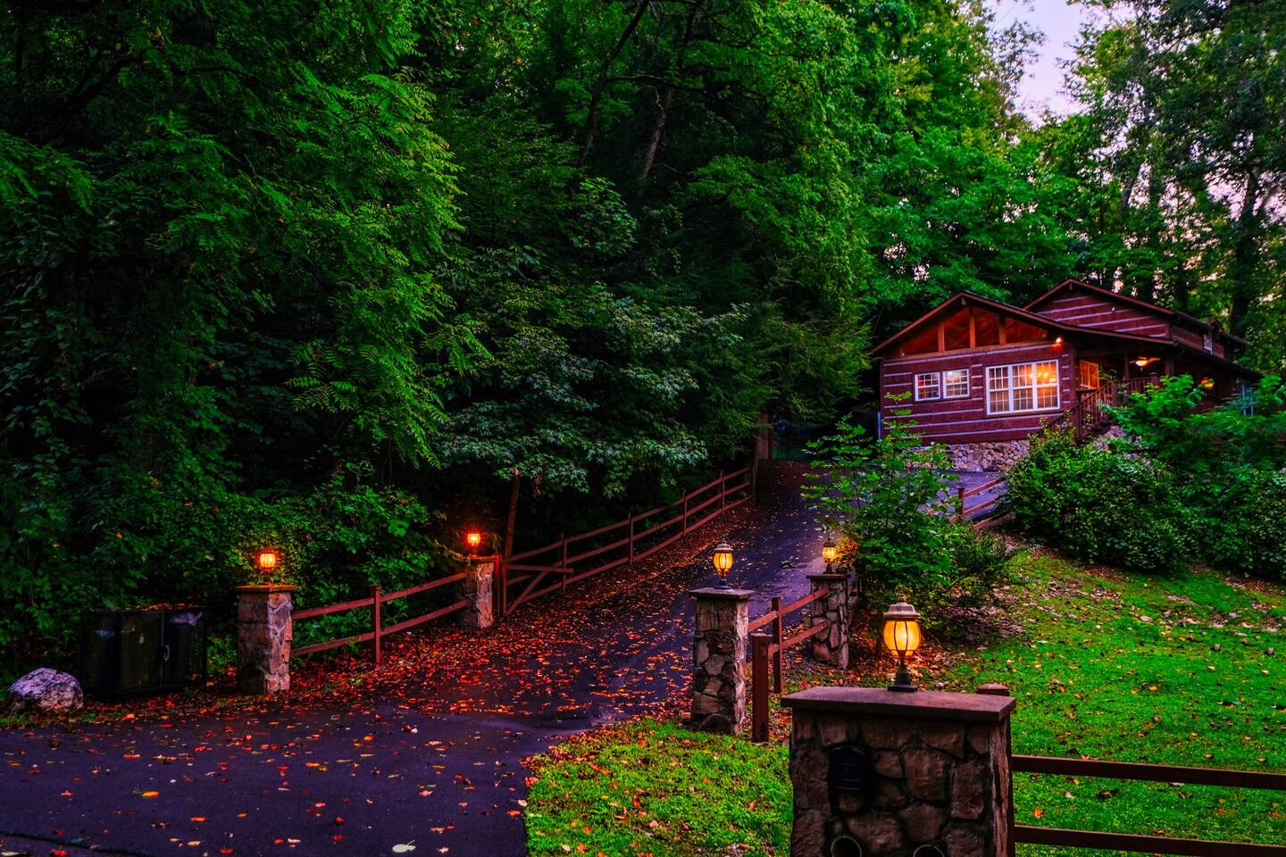 Long, private driveway.  Multiple cars and fit.  Carport is to the left of the cabin.