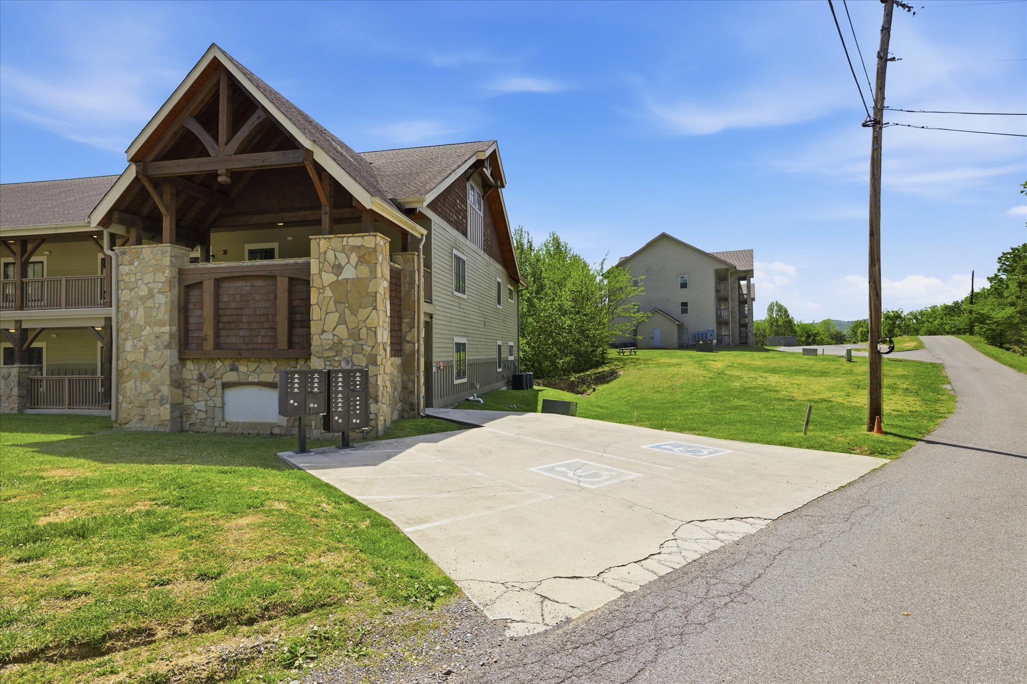 Just steps from Hearthstone Lodge - the 700 building, designated handicap parking provides easy, accessible entry near the mailbox area for added convenience.