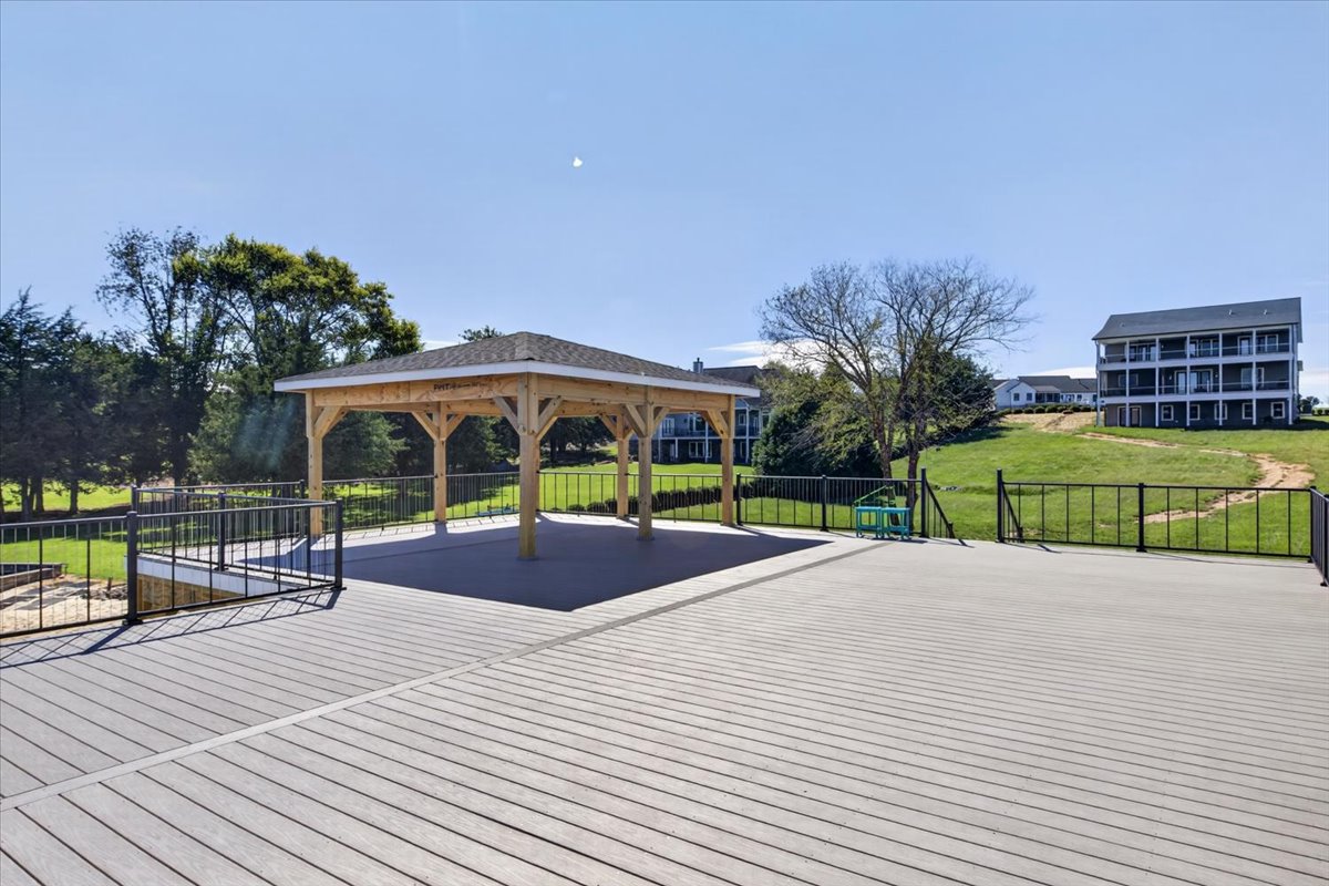 Expansive upper-level deck with a covered pavilion and plenty of space for outdoor entertaining.
