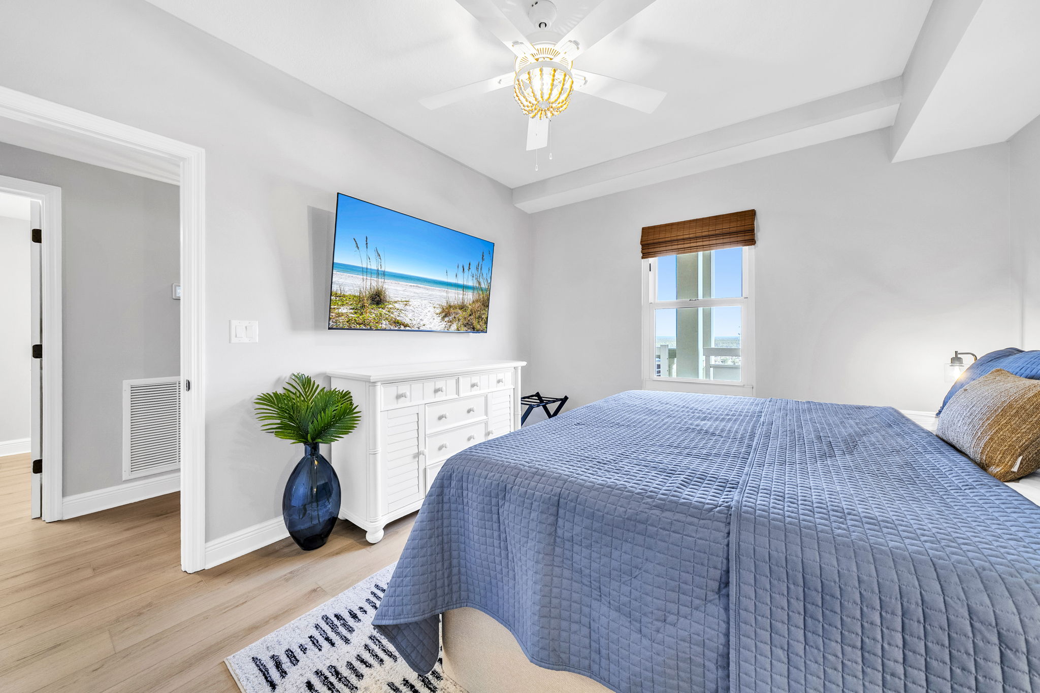 Relax in the second king suite featuring a comfortable bed, calming coastal tones, and a 65" smart TV with YouTube TV included or the option to log into your favorite apps.