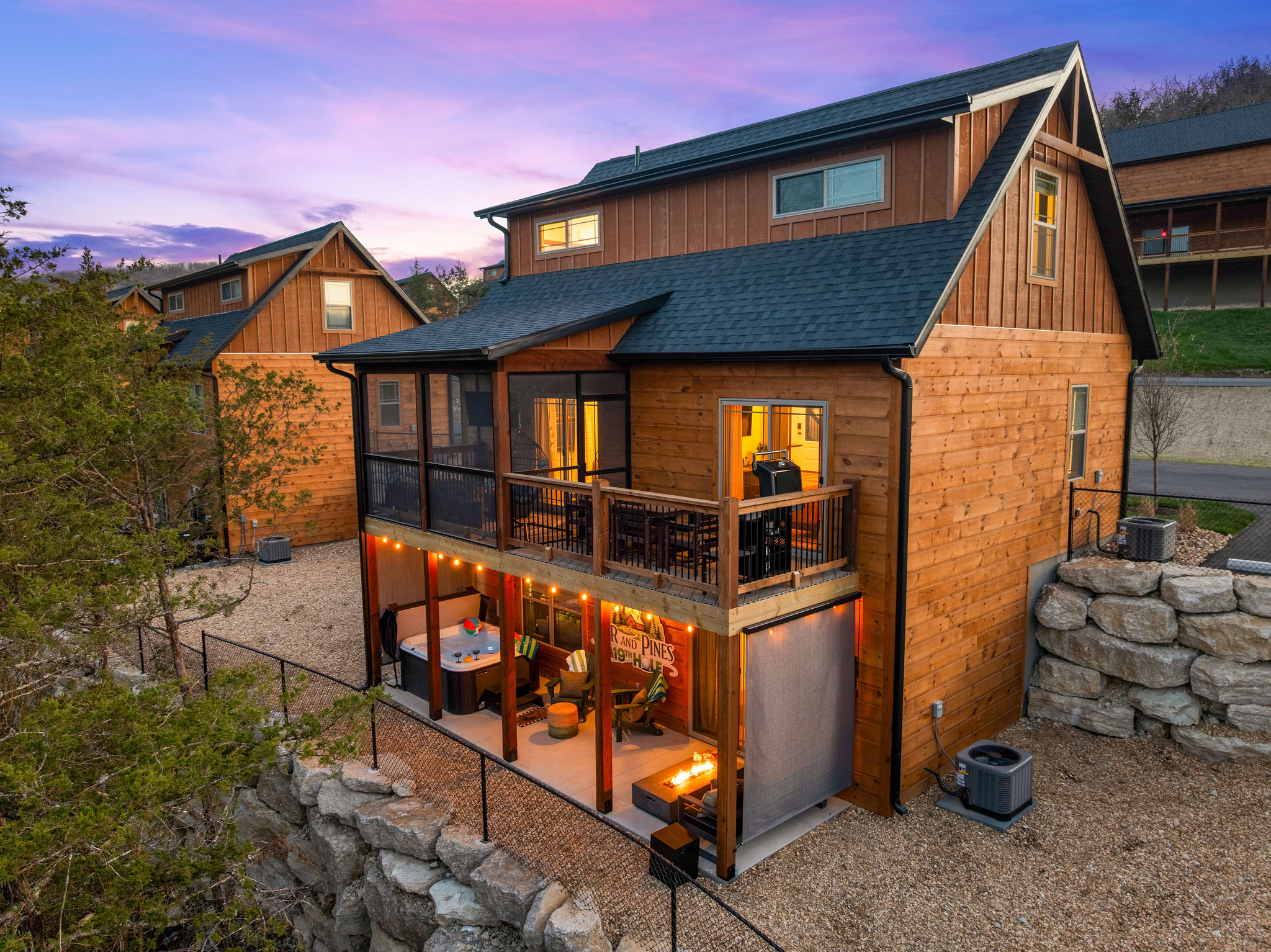 Par and Pine has two private decks to enjoy the outdoors with private hot tub, fire pit, propane BBQ grill and screened in area with a smart TV.