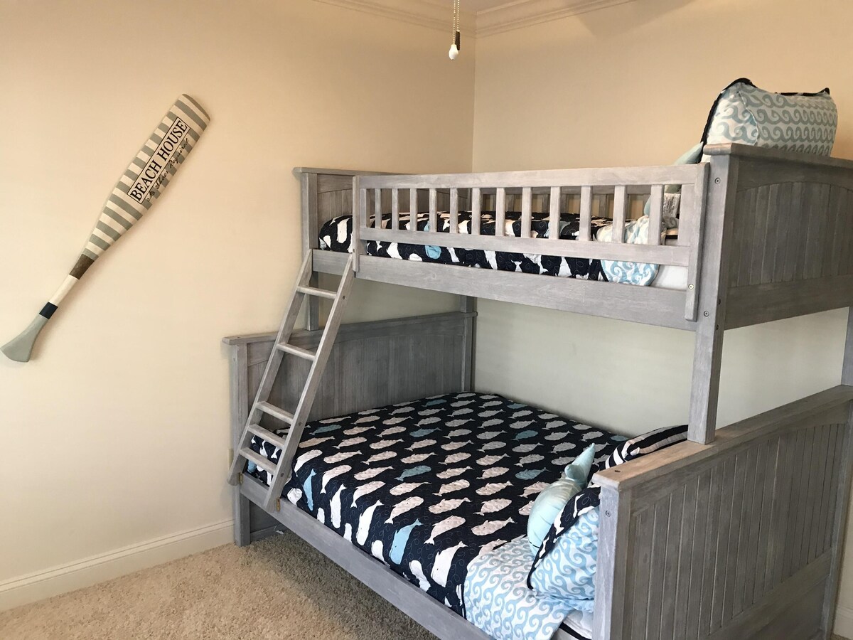 Bedroom w/ full below twin bunks (sleeps 3), TV, and balcony