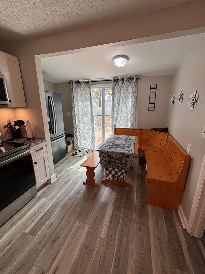 Sliding Glass door leads to outside patio and fenced yard.