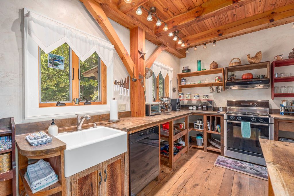 Equipped with a dishwasher and gas range, making meal prep a breeze in the kitchen of the cottage. 