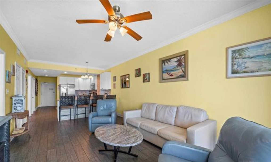 Living room with awesome view, leather queen sleeper sofa with memory foam mattress, 2 leather rocker/swivel recliners, 55" SMART TV & balcony access