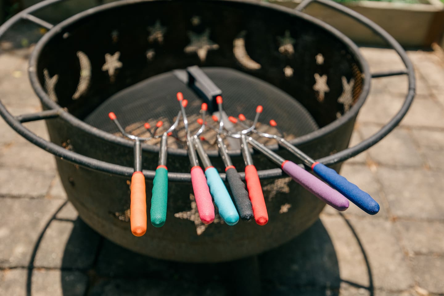 Fire pit with s'more or hotdog sticks.