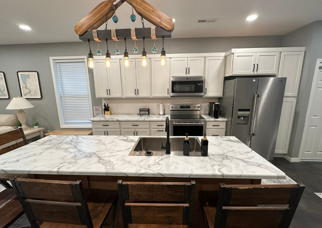View of the kitchen with custom made island light fixture.