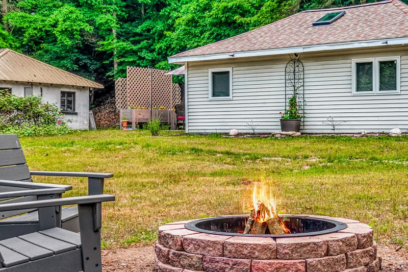 Enjoy fresh spring air, outdoor seating, and a cozy firepit for relaxing evenings outside.