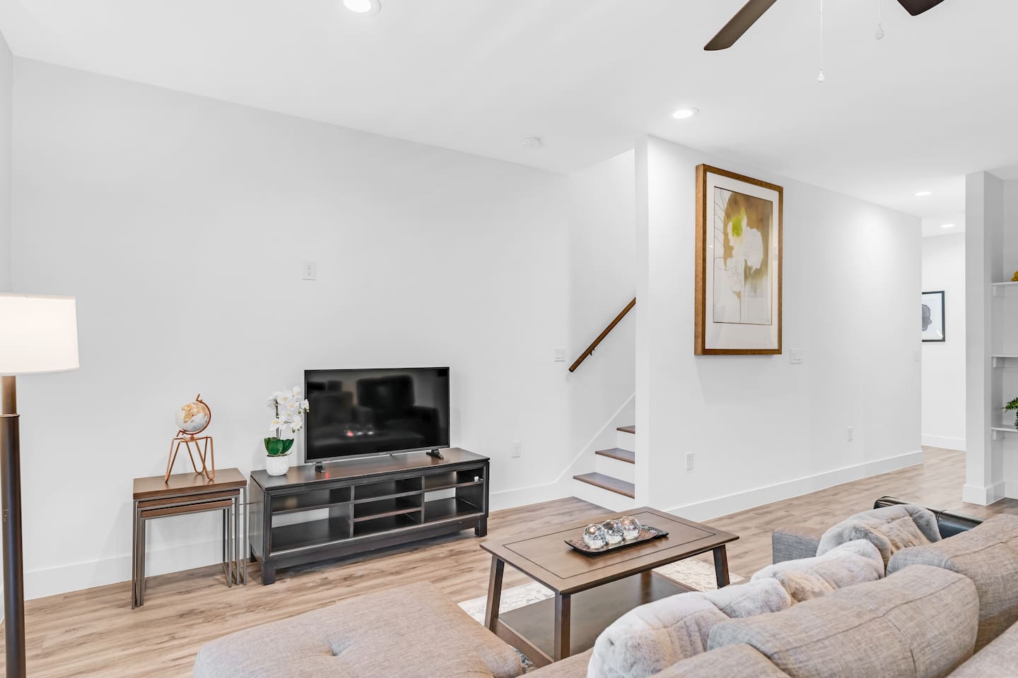 Cozy living room featuring a flat-screen TV and stylish decor—ideal for relaxing movie nights after exploring the area.