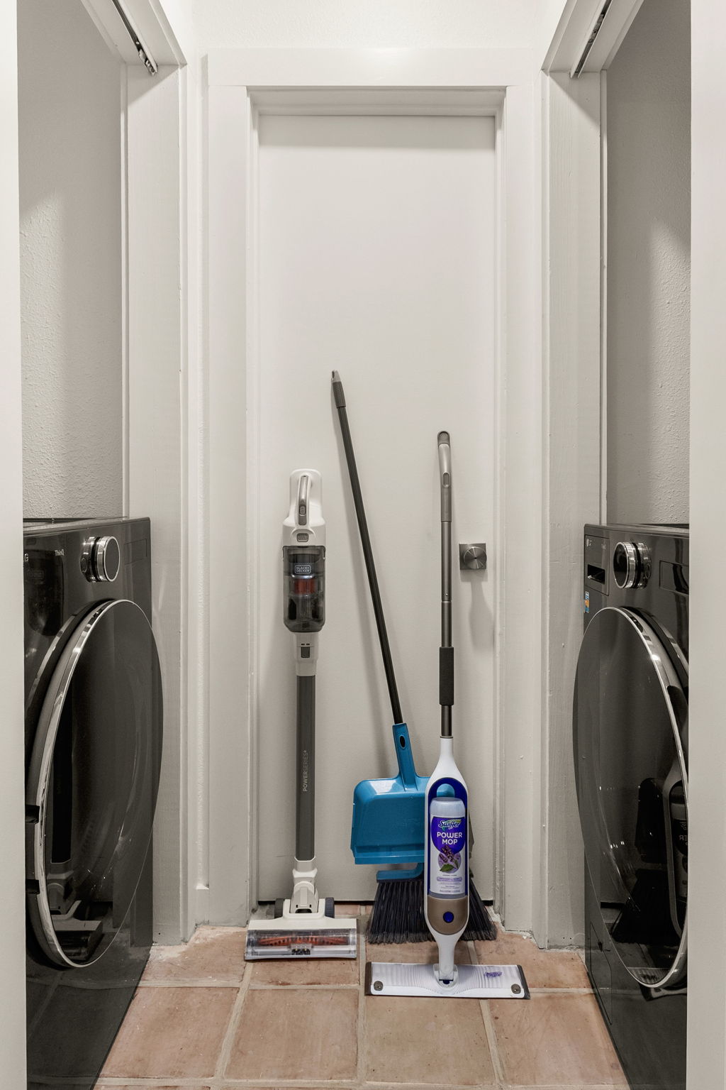 Another laundry area view with cleaning supplies