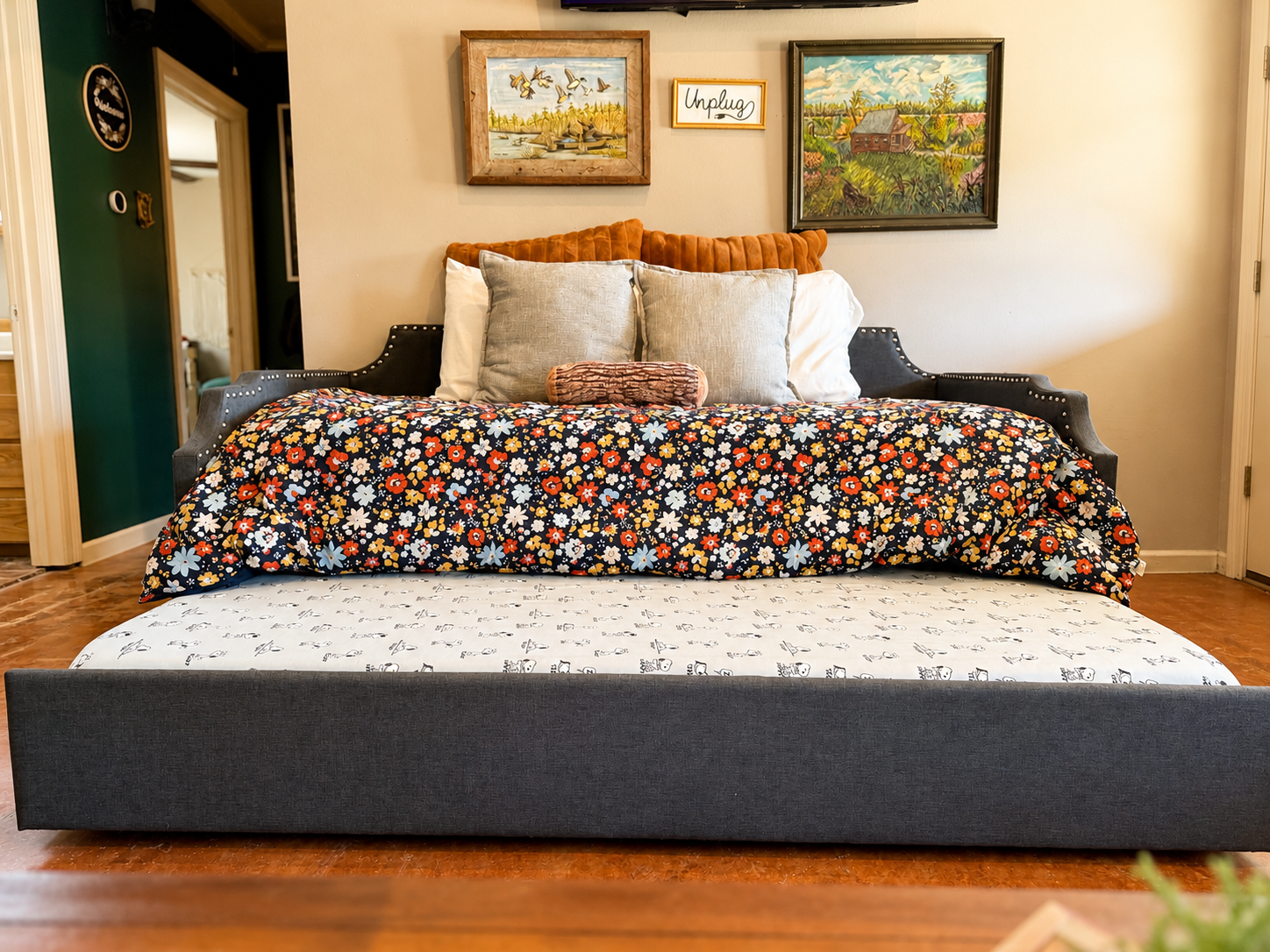 Gathering Room Daybed converts into a double twin bed sleeping space with a trundle bed underneath. And for our smaller groups? It a comfortable reading spot with a view of the surrounding woods.