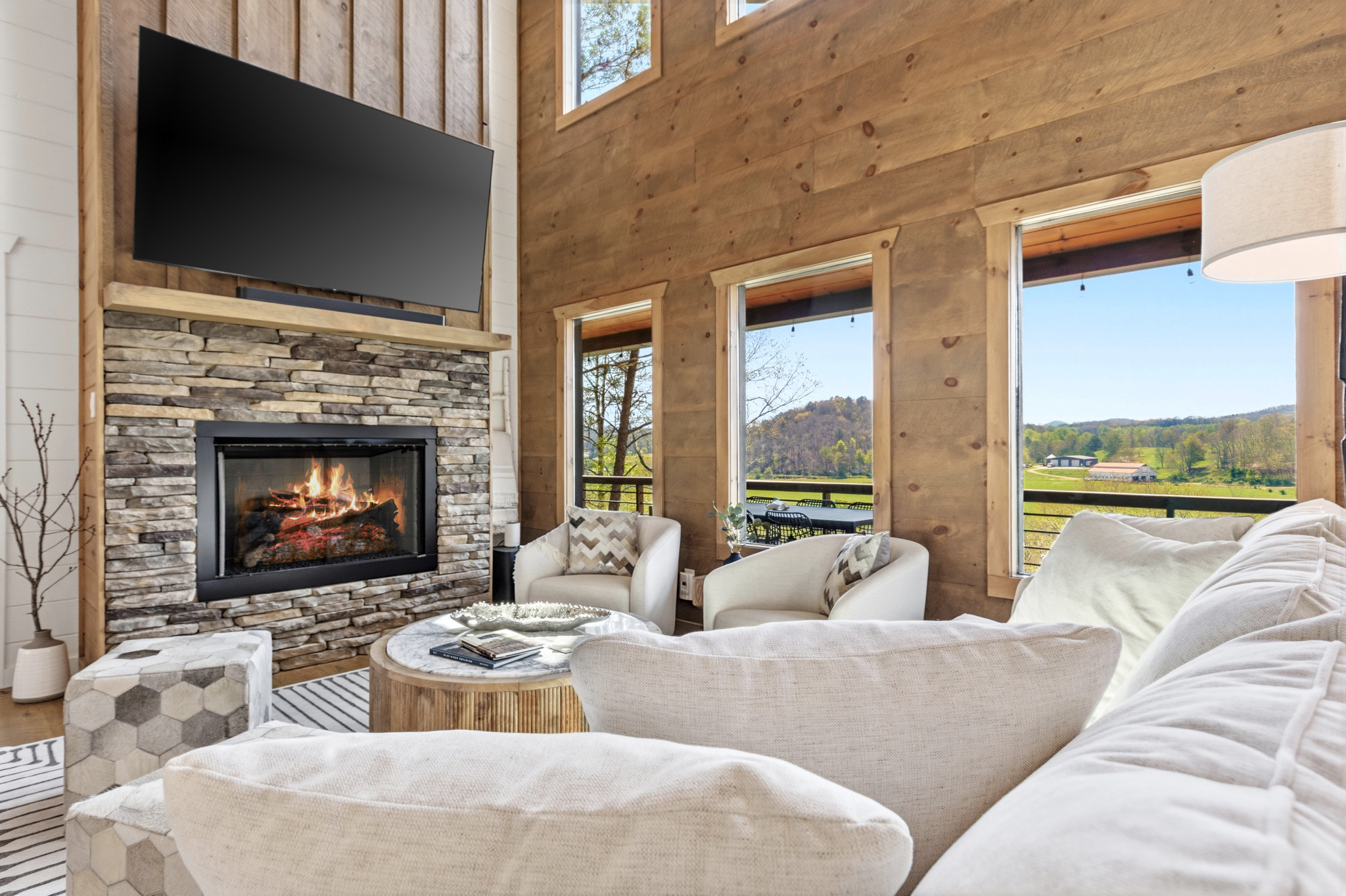 Relax on the deep, down-filled, couch while enjoying a breathtaking view of the mountains and pastures. The fireplace will keep you cozy and the 75" TV with immersive sound does not disappoint!