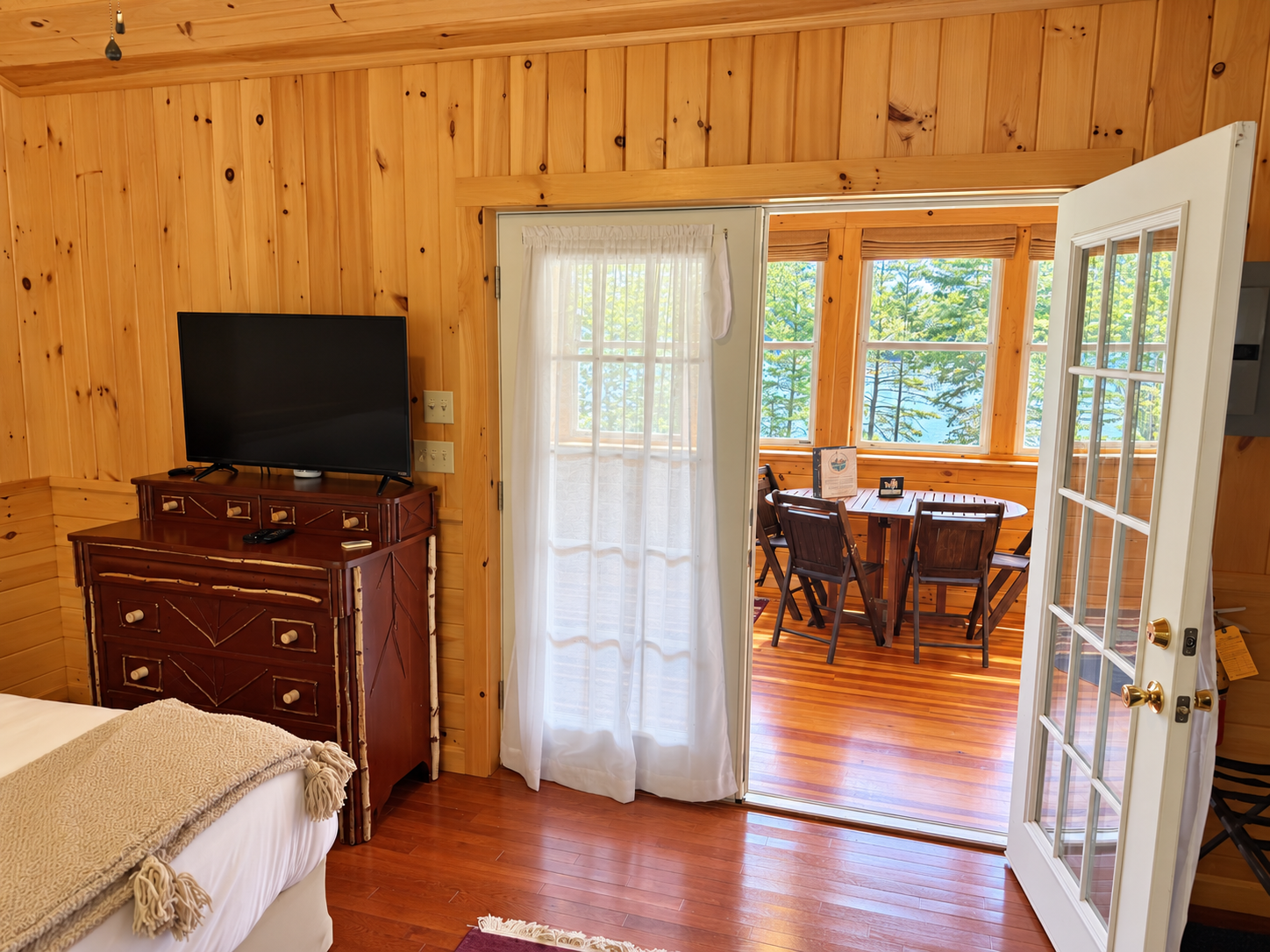 Queen bedroom with French doors to living room