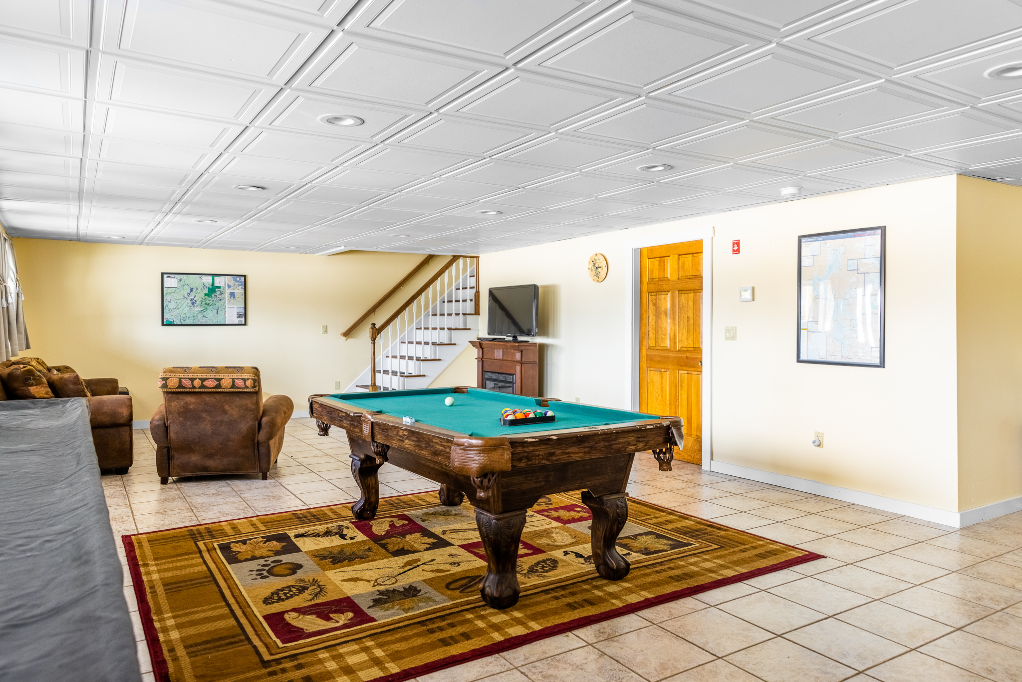 Game room: pool table, ping pong table, shuffleboard table, games, TV, sleeper sofa.