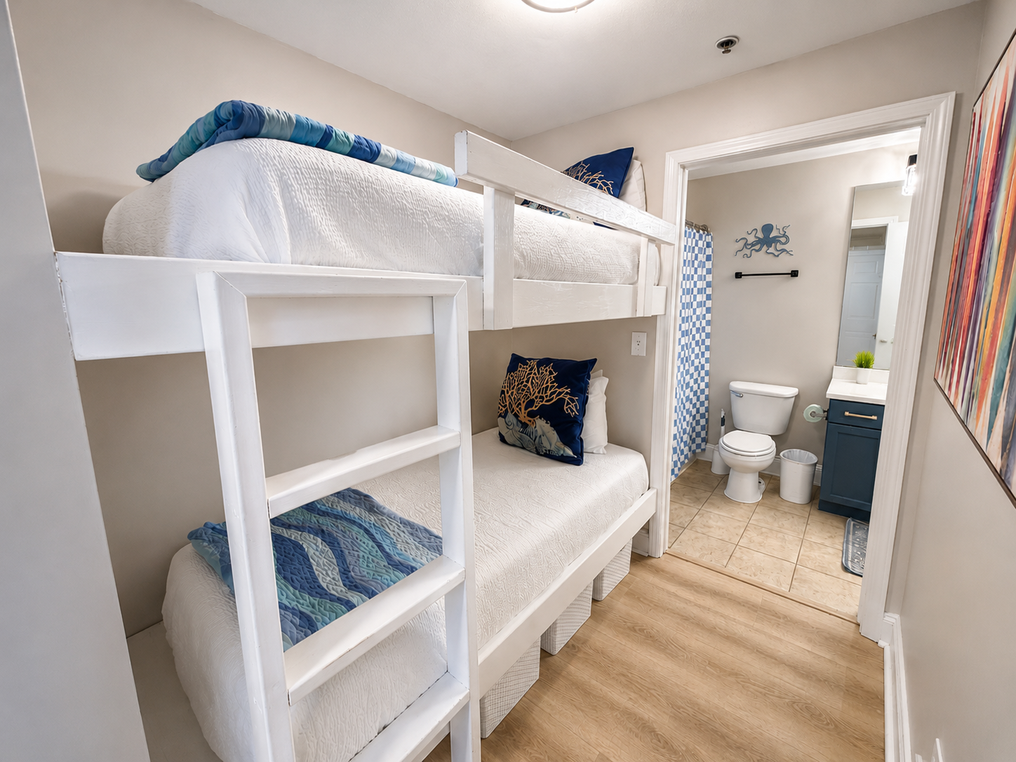 Bunk room with barn door and bathroom access