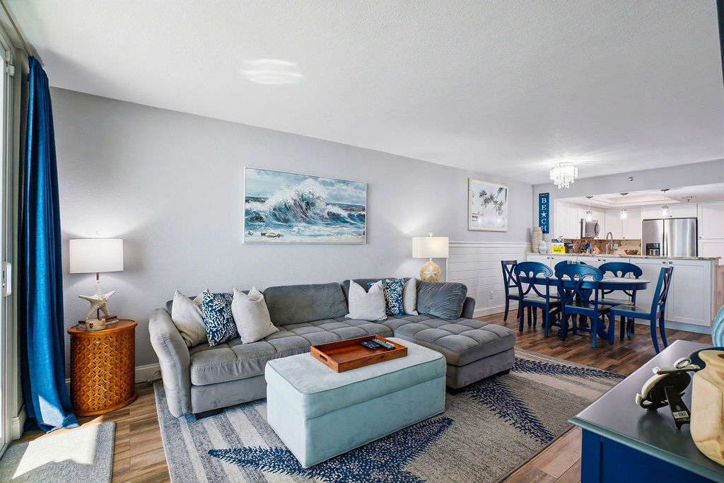 Spacious open-concept living and dining area in this beachfront vacation rental, designed for relaxing and entertaining after a day at the beach.