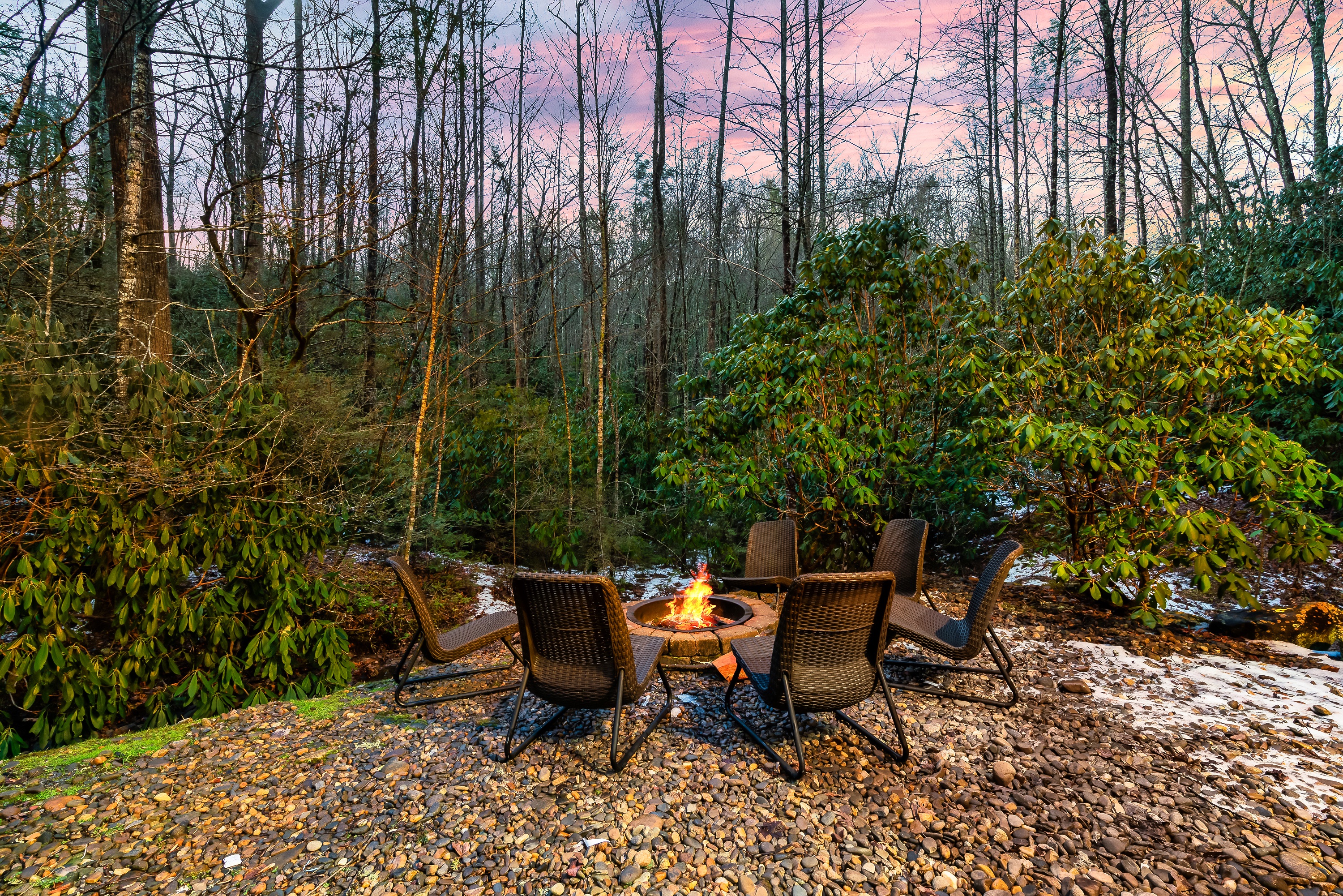 Enjoy the fire pit by the mountain stream while taking in the Smoky Mountains