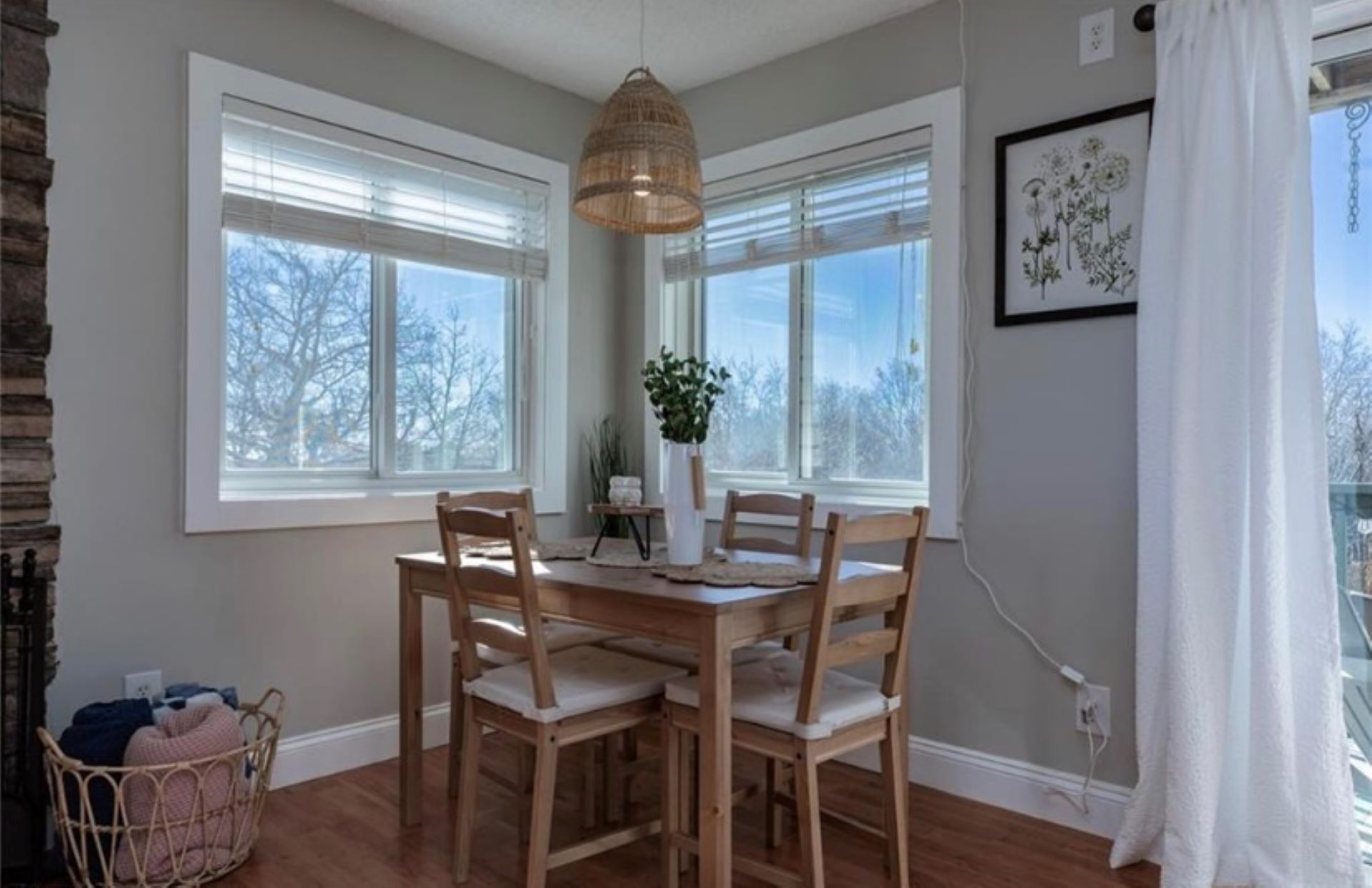 Dining area for four. Additional seating available on chairs and sofa with tray tables for dining.