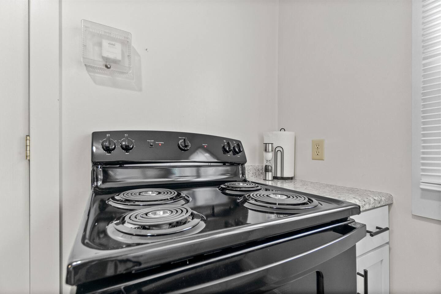 Modern full kitchen featuring a sleek stove with an oven below, designed for efficient cooking and stylish functionality. A perfect blend of contemporary design and practicality, ideal for creating meals with ease