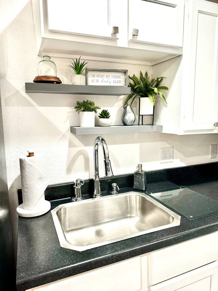 No dishwasher but you will have dish soap, drain tray, and plenty of dish towels. Paper towels 