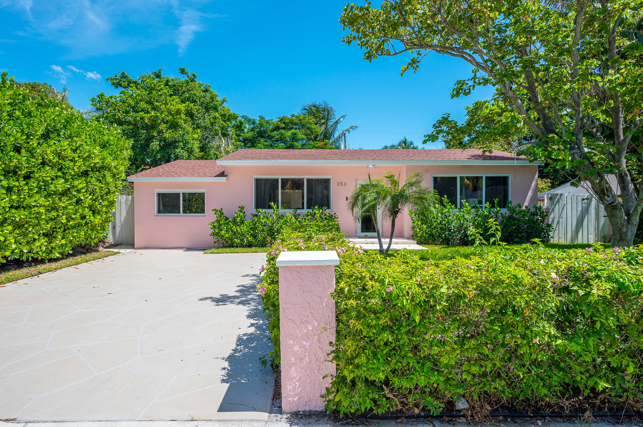 This charming SoSo home welcomes you with its cheerful pink exterior, tropical landscaping, and coastal charm. Located in a safe, walkable neighborhood—just steps from shops, and restaurants.