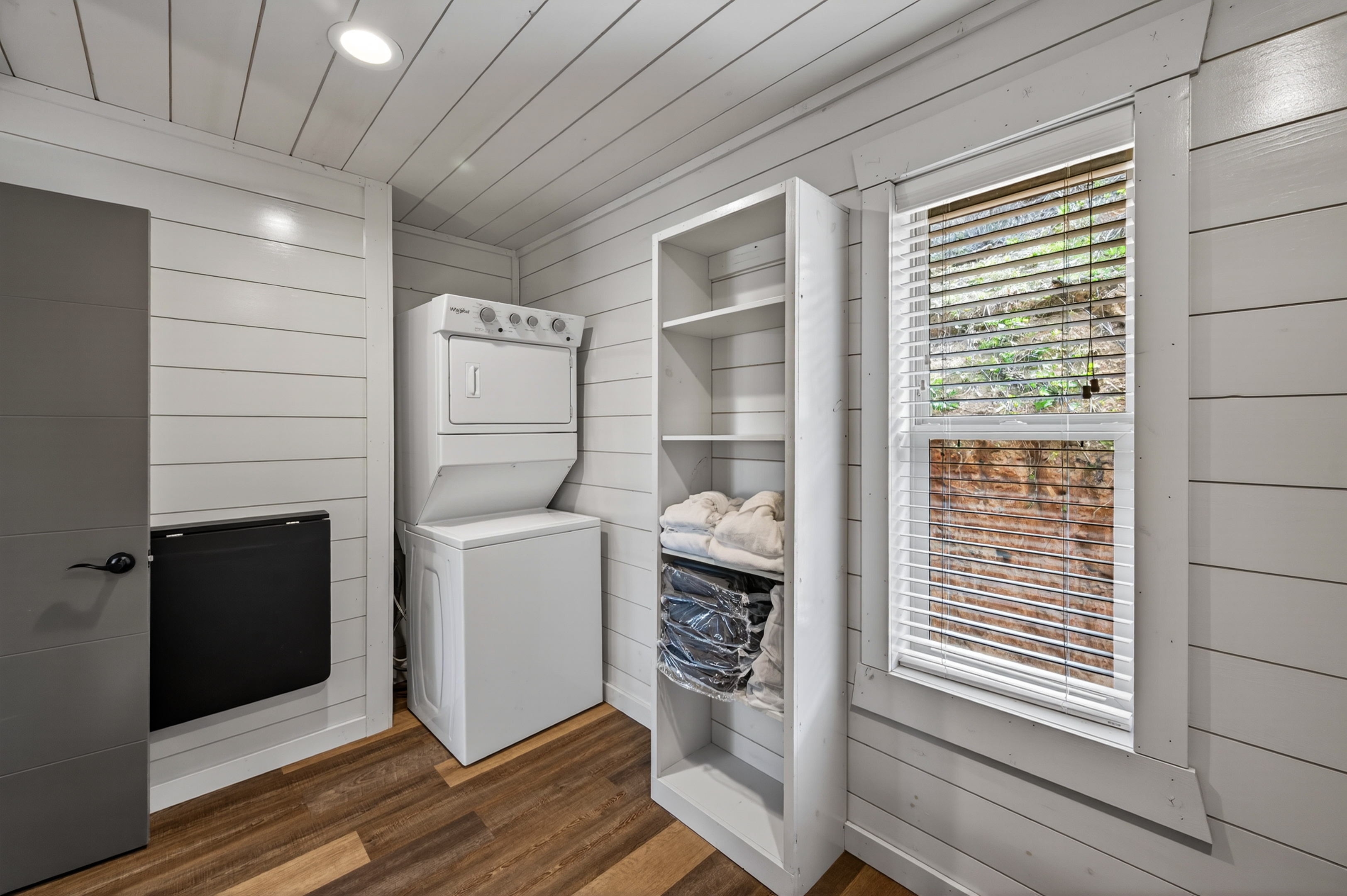 Walk-in closet with washer and dryer.