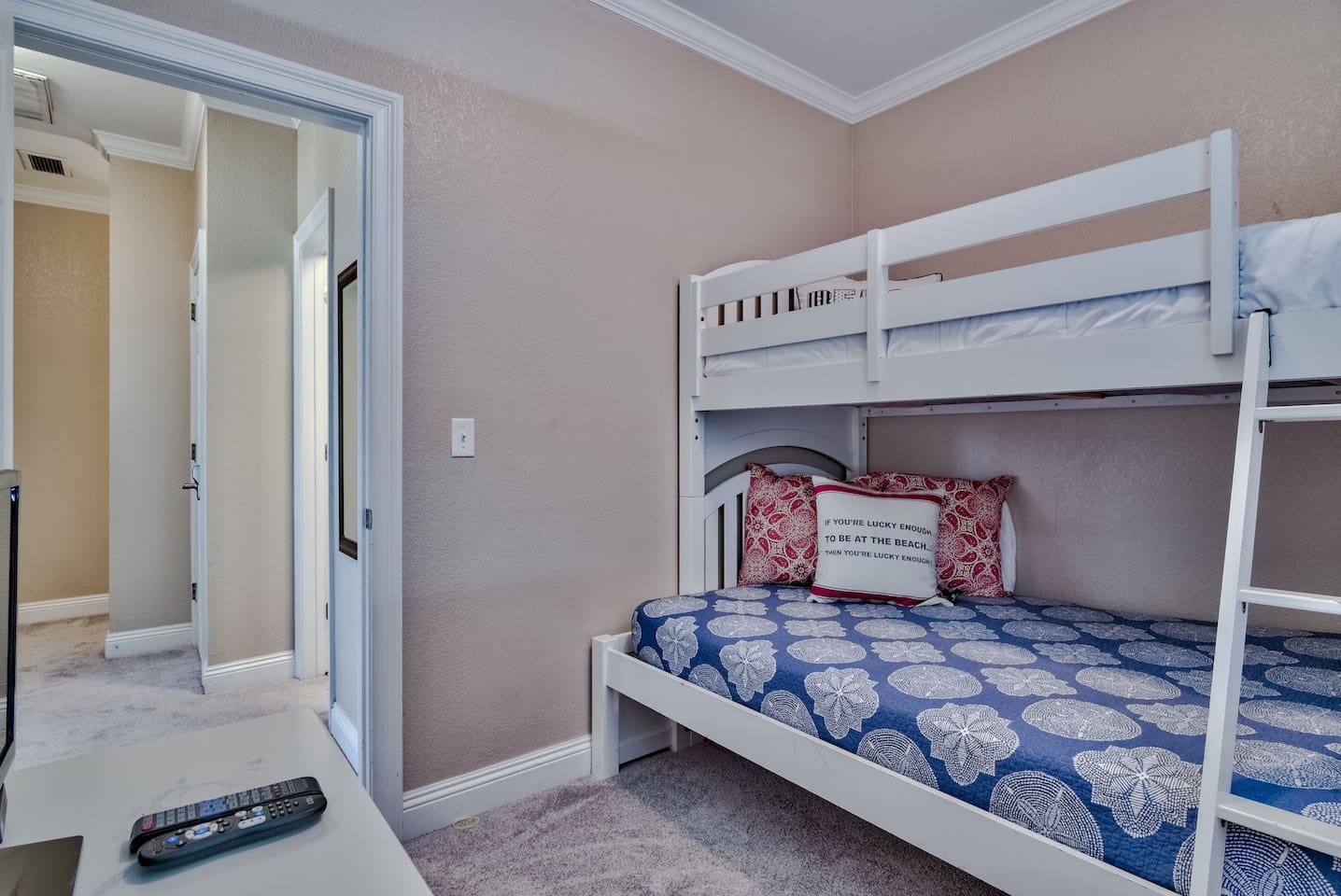 BEDROOM #6- 3RD FLOOR BUNK ROOM (Twin over Full bunk room, features a dresser and a TV)