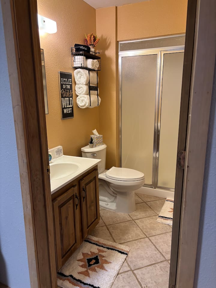 Main bathroom located off the dining room/kitchen.  Shower with shampoo, conditioner and body wash provided