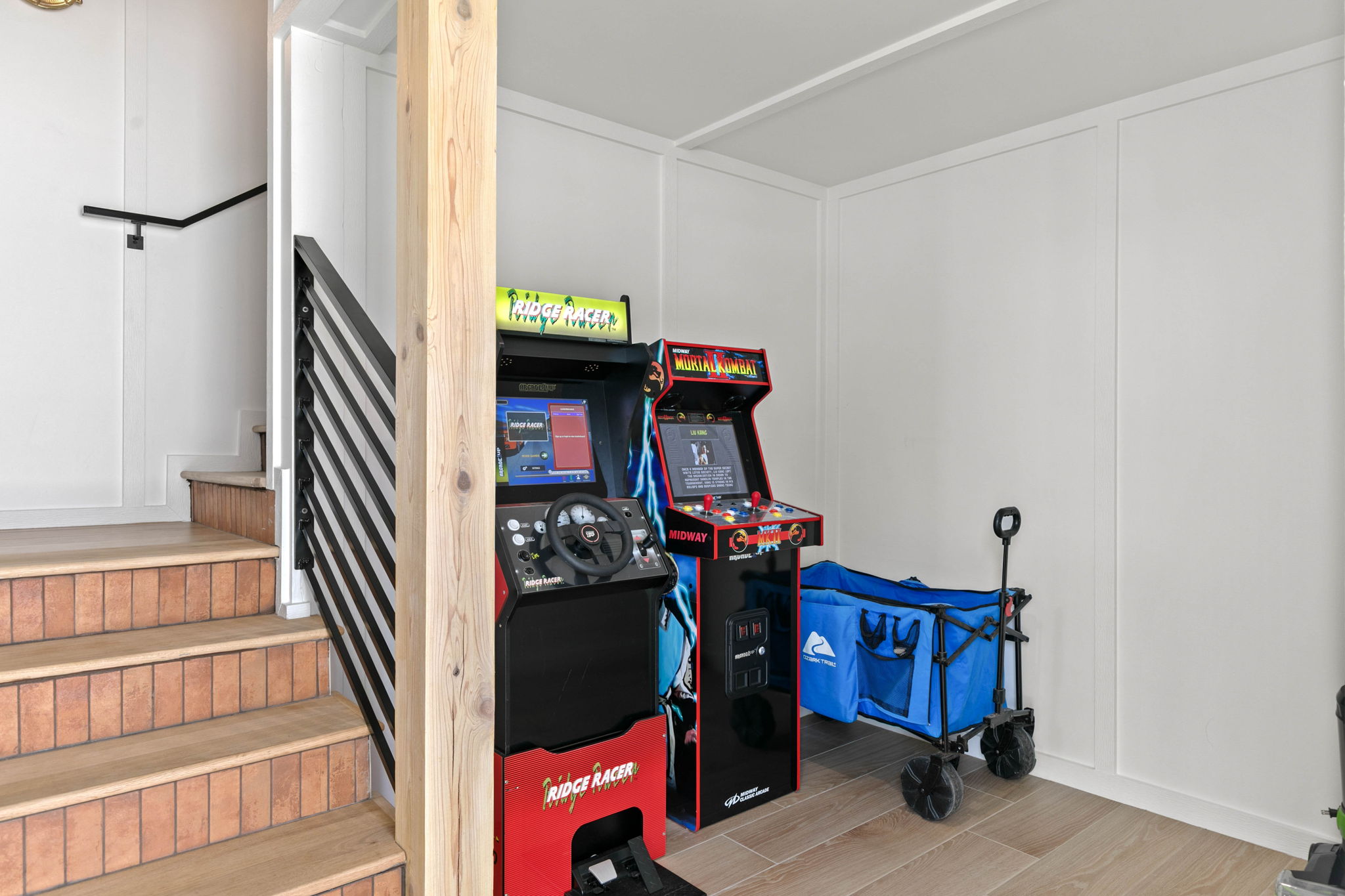 The arcade area includes two games, with a beach wagon ready to help haul gear to the nearby Gulf access.