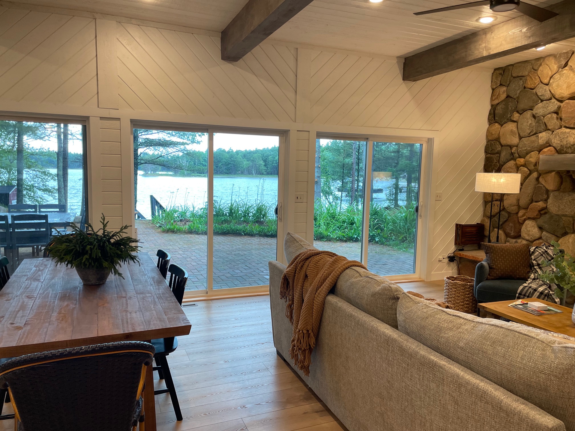 A wall of windows offers panoramic views of the lake